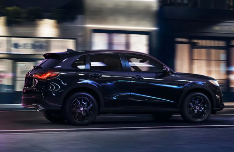 One blue color 2024 Honda HR-V is running on the road.